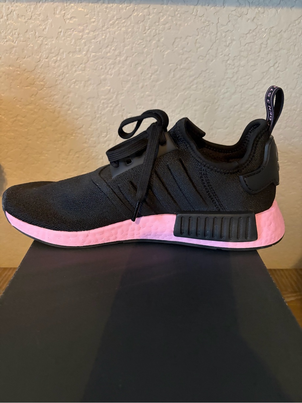 Women’s Adidas NMD R1 ‘Black True Pink’ sneakers.